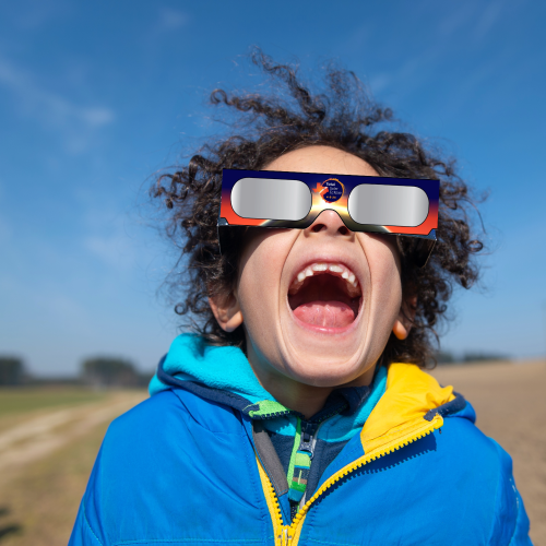 boy with solar eclipse glasses